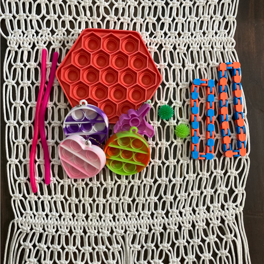 Hexagon pop it, 2 wacky tracks, 2 monkey noodles, 4 mini pop its.